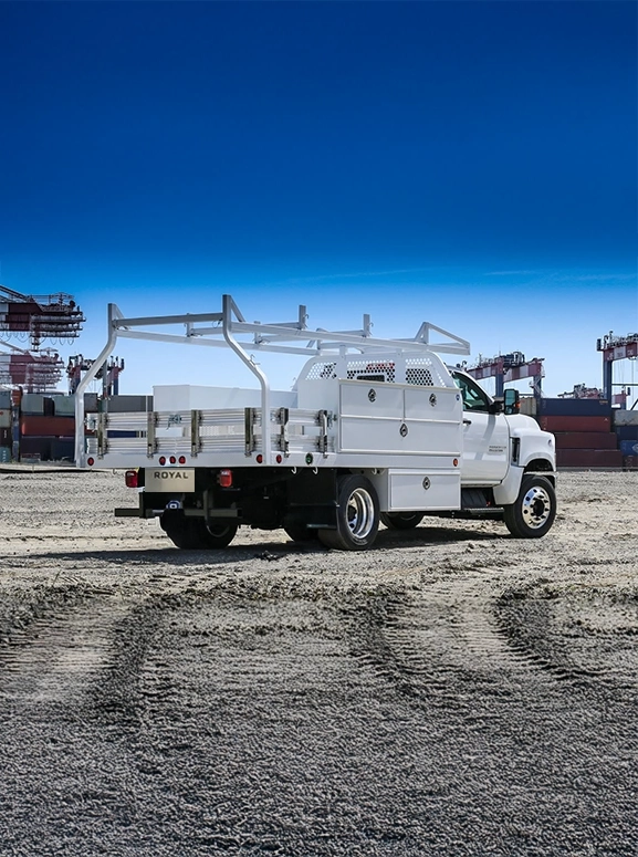 white upfitted truck at a work site