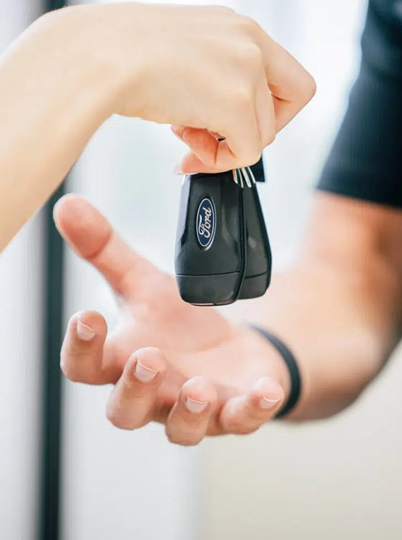 keys are being handed over after a financing agreement in Sacramento