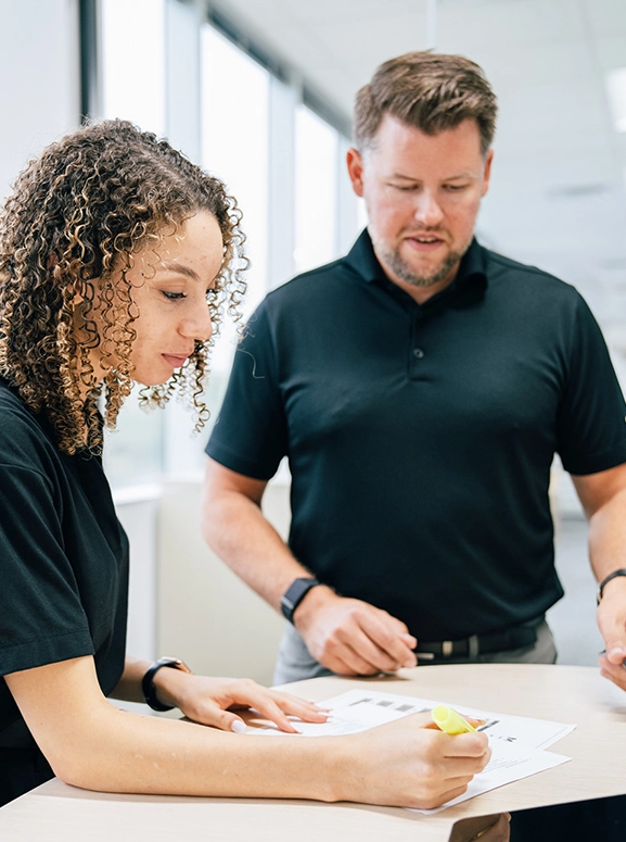 woman and man looking at forms for renting a vehicle in Sacramento